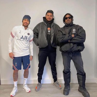 Kanye and Laboy are wearing all black while Neymar is on a PSG kit.